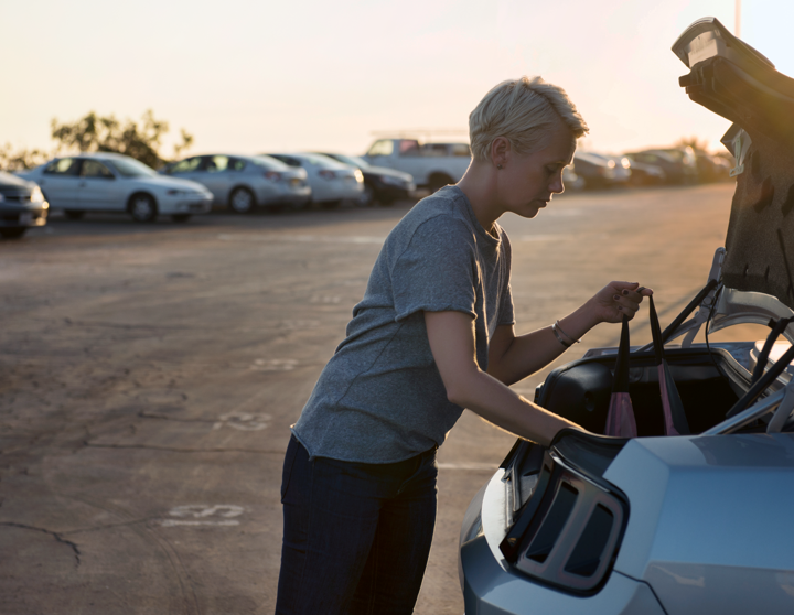 Woman with packaging a car