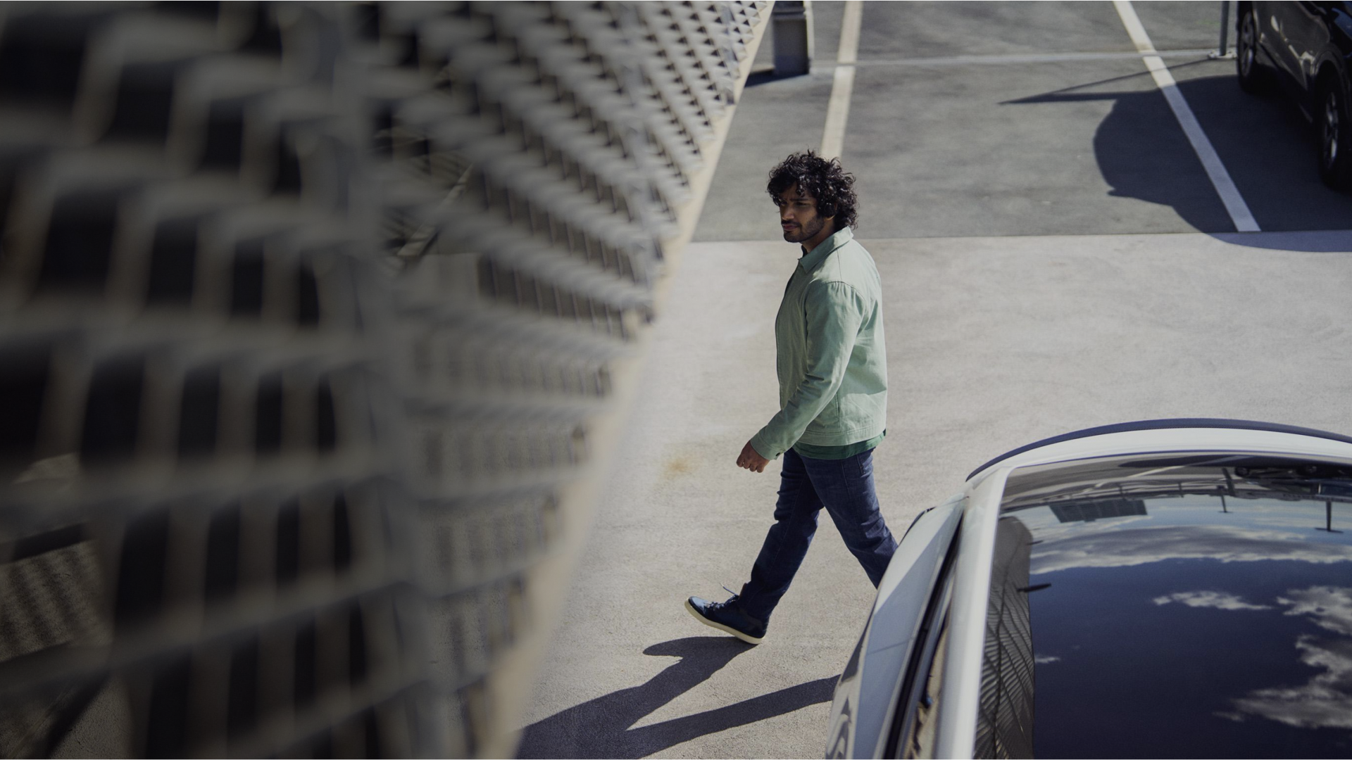 Man walking in free-flow parking lot