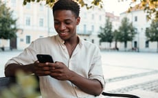 Person looking at their budget on a phone screen