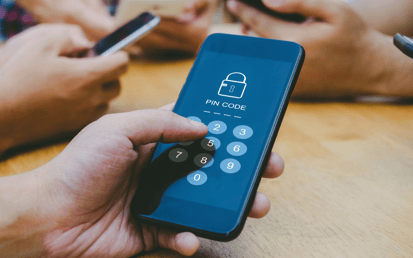 A hand making an online purchase with Strong Customer Authentication on a phone