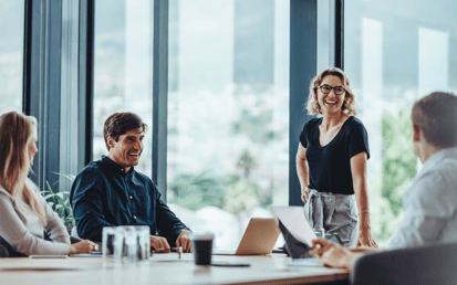 A group of people in a meeting room 