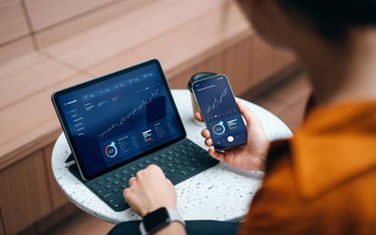 Showing kpi's in debt collection at an tablet and phone