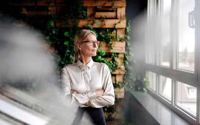 A woman looks out the window