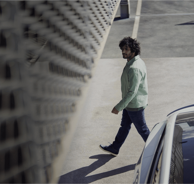 Man walking in free-flow parking lot