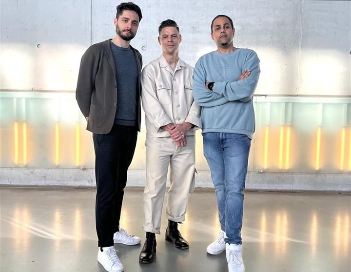 Three men from the EV team smiling