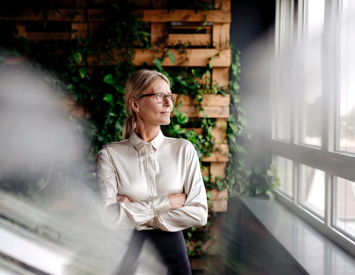 A woman looks out the window