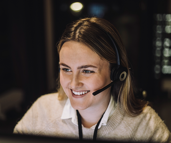 Woman smiling with a headset